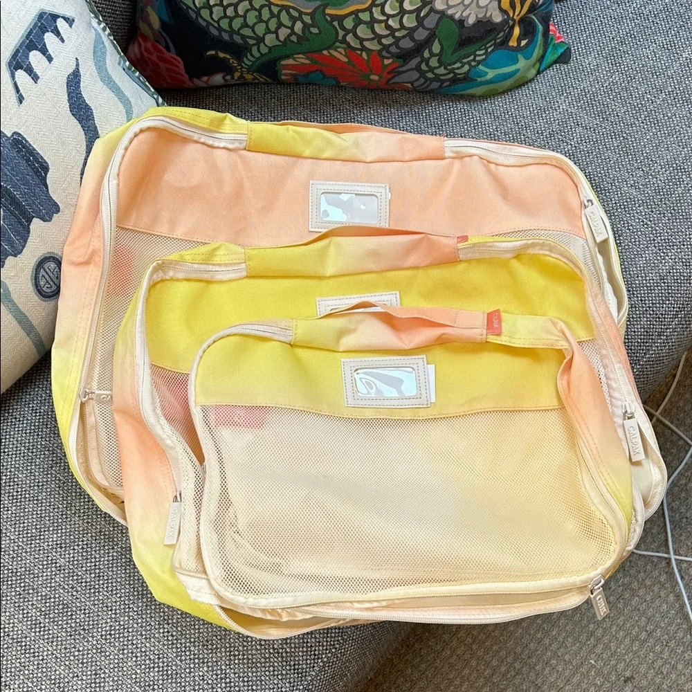 Calpak Yellow and Cream Garment Bags